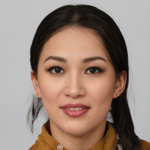 Joyful white young-adult female with medium  black hair and brown eyes