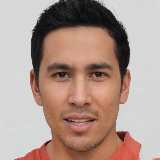 Joyful asian young-adult male with short  brown hair and brown eyes