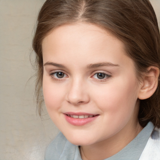 Joyful white child female with medium  brown hair and brown eyes