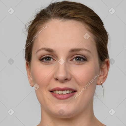 Joyful white young-adult female with medium  brown hair and grey eyes