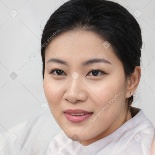 Joyful asian young-adult female with medium  brown hair and brown eyes