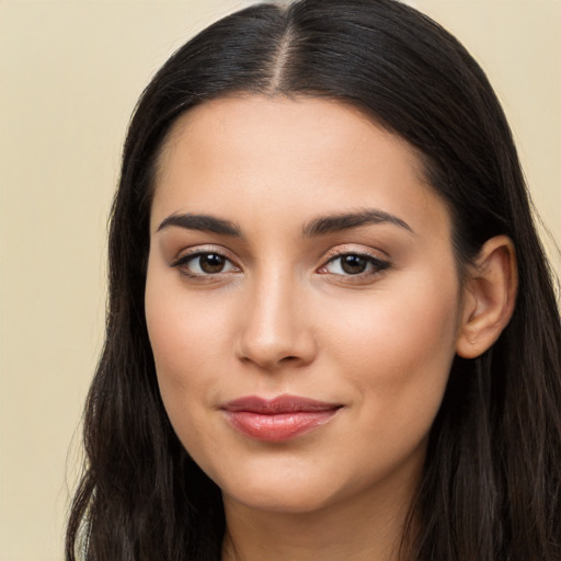 Joyful latino young-adult female with long  brown hair and brown eyes