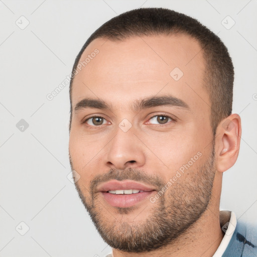 Joyful white young-adult male with short  brown hair and brown eyes