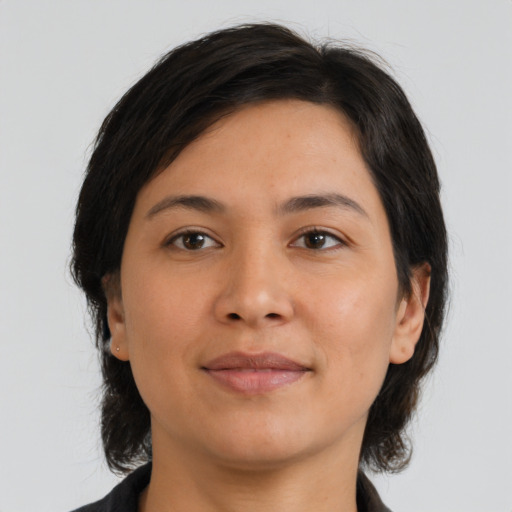 Joyful asian young-adult female with medium  brown hair and brown eyes