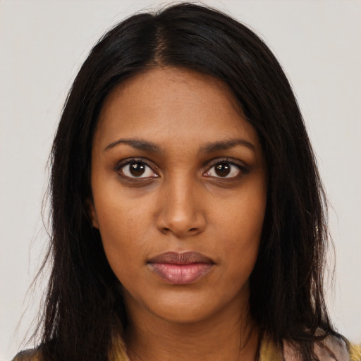 Neutral black young-adult female with long  brown hair and brown eyes