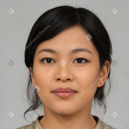 Joyful asian young-adult female with medium  black hair and brown eyes