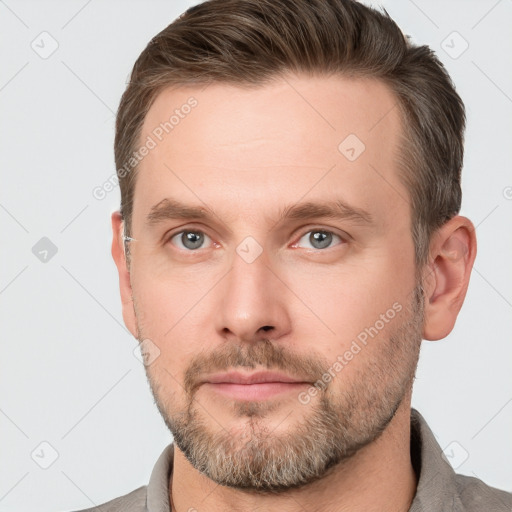 Neutral white young-adult male with short  brown hair and grey eyes