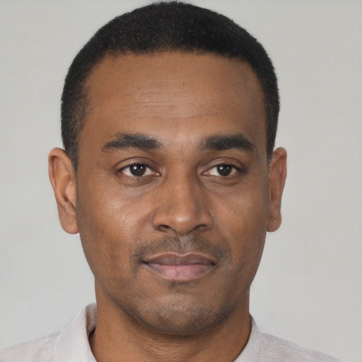 Neutral black young-adult male with short  black hair and brown eyes