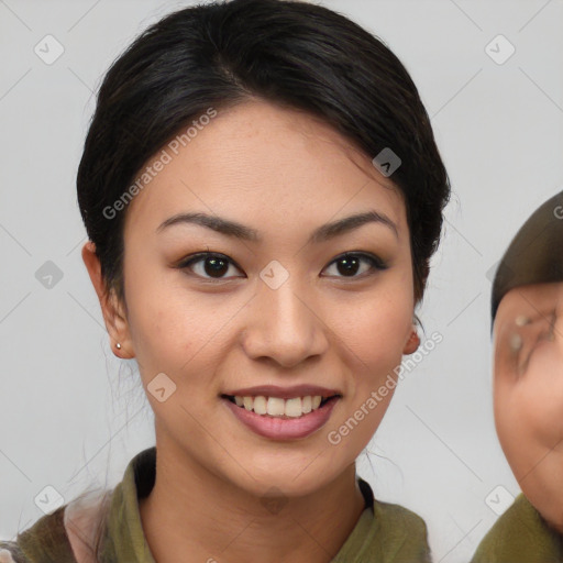 Joyful asian young-adult female with medium  brown hair and brown eyes