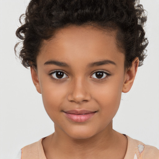 Joyful white child female with short  brown hair and brown eyes