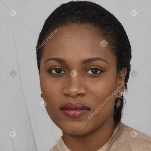 Joyful black young-adult female with medium  black hair and brown eyes