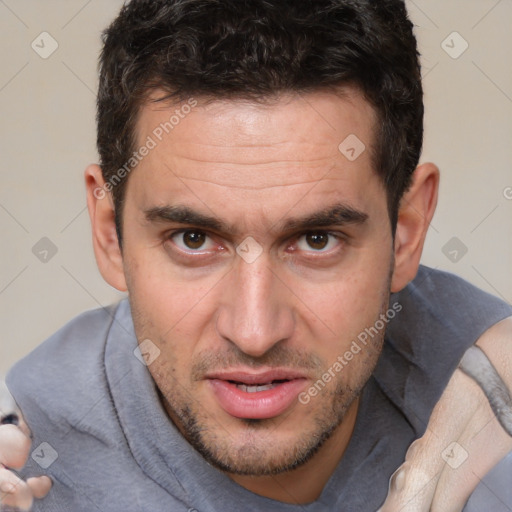 Joyful white adult male with short  brown hair and brown eyes