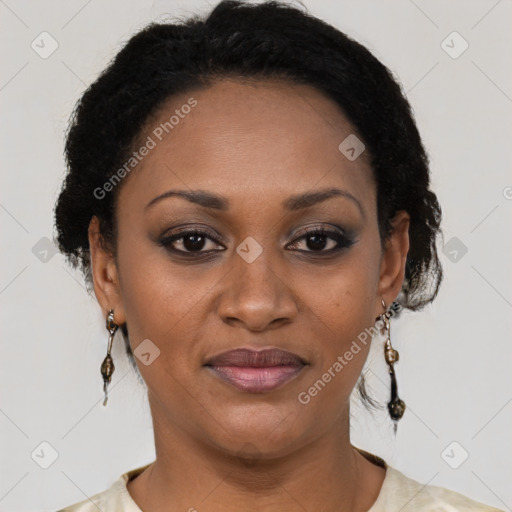 Joyful black adult female with short  brown hair and brown eyes