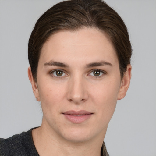 Joyful white young-adult female with short  brown hair and grey eyes