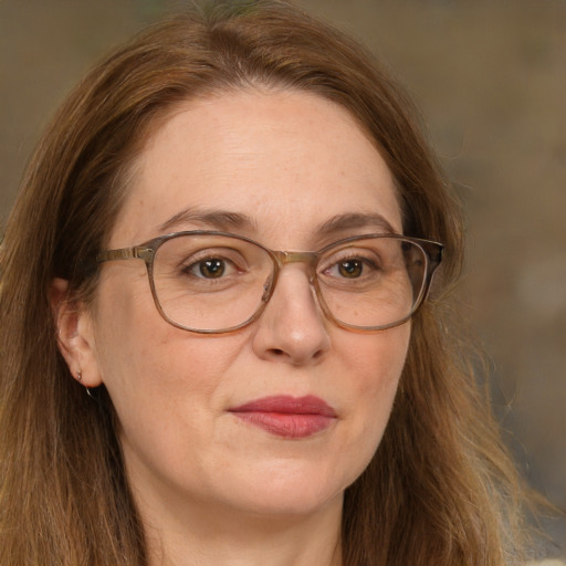 Joyful white adult female with long  brown hair and brown eyes