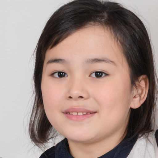 Joyful white child female with medium  brown hair and brown eyes