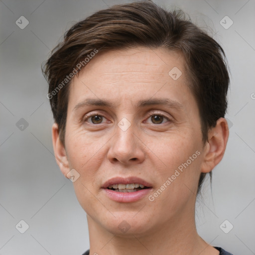 Joyful white adult female with short  brown hair and brown eyes