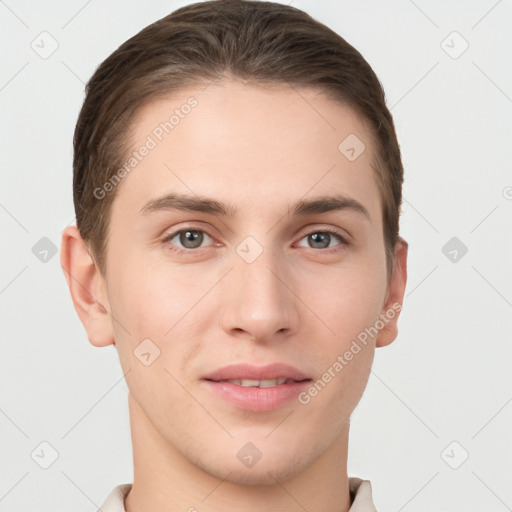 Joyful white young-adult male with short  brown hair and grey eyes