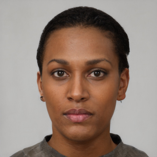Neutral black young-adult female with short  black hair and brown eyes