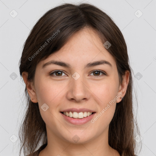 Joyful white young-adult female with long  brown hair and grey eyes