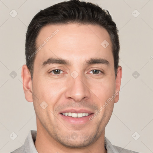 Joyful white young-adult male with short  brown hair and brown eyes