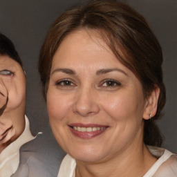 Joyful white adult female with medium  brown hair and brown eyes