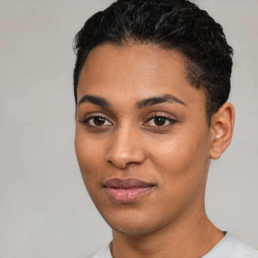Joyful latino young-adult female with short  black hair and brown eyes