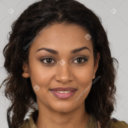 Joyful black young-adult female with long  brown hair and brown eyes