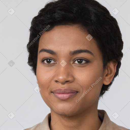 Joyful black young-adult female with short  black hair and brown eyes