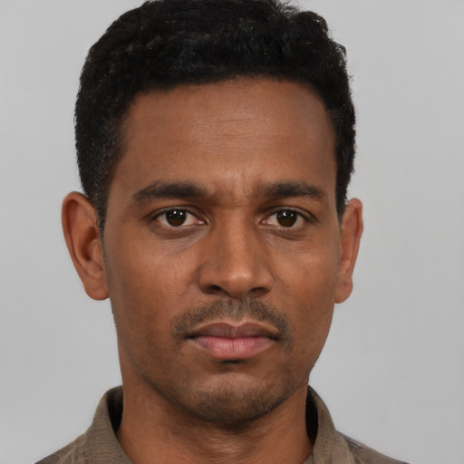 Neutral black young-adult male with short  black hair and brown eyes