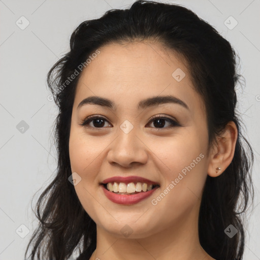 Joyful latino young-adult female with long  brown hair and brown eyes