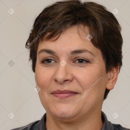 Joyful white adult female with short  brown hair and brown eyes