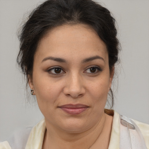 Joyful latino young-adult female with medium  brown hair and brown eyes