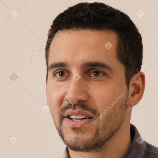 Joyful white young-adult male with short  black hair and brown eyes