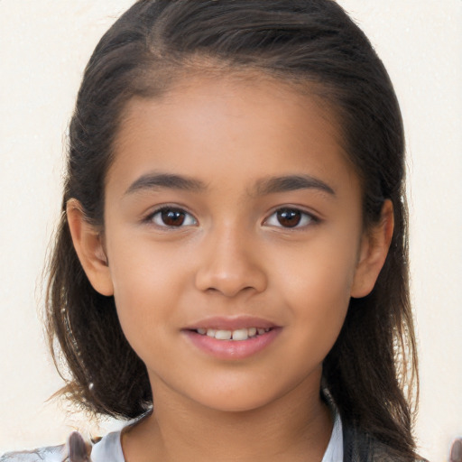 Joyful white child female with long  brown hair and brown eyes