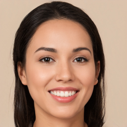 Joyful white young-adult female with long  brown hair and brown eyes