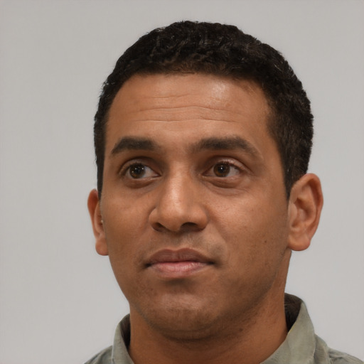 Neutral black young-adult male with short  black hair and brown eyes