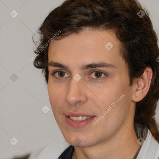 Joyful white young-adult male with medium  brown hair and brown eyes