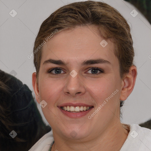 Joyful white young-adult female with medium  brown hair and grey eyes