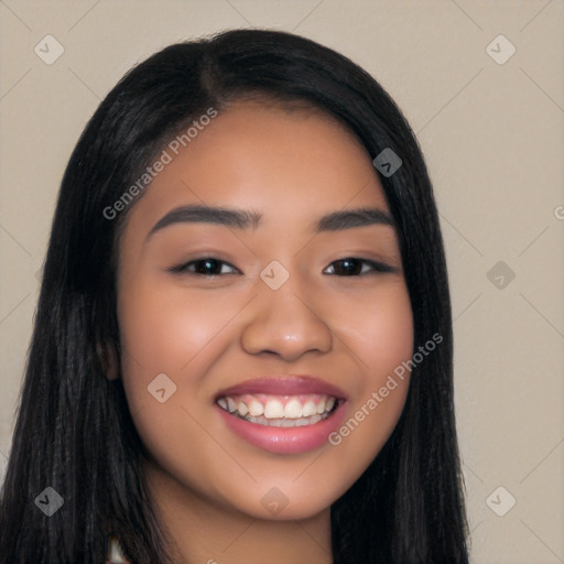 Joyful latino young-adult female with long  black hair and brown eyes