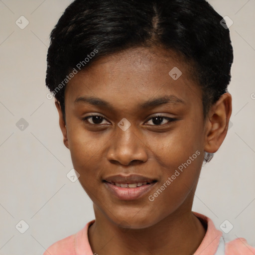 Joyful black young-adult female with short  brown hair and brown eyes