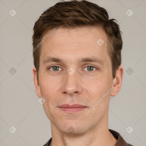 Joyful white adult male with short  brown hair and grey eyes