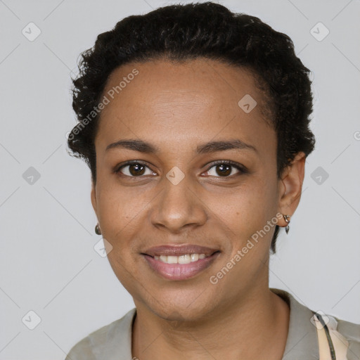 Joyful black young-adult female with short  black hair and brown eyes