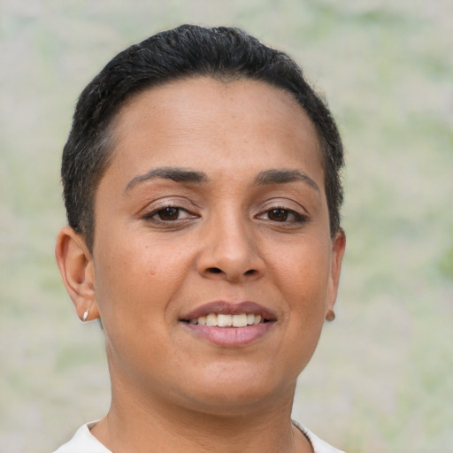 Joyful latino young-adult female with short  brown hair and brown eyes