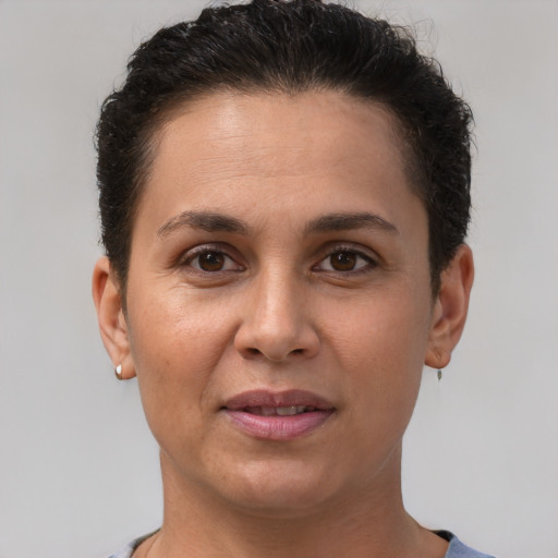 Joyful white adult female with short  brown hair and brown eyes