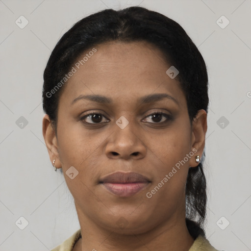 Joyful black young-adult female with short  black hair and brown eyes