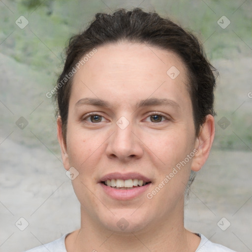 Joyful white young-adult female with short  brown hair and grey eyes