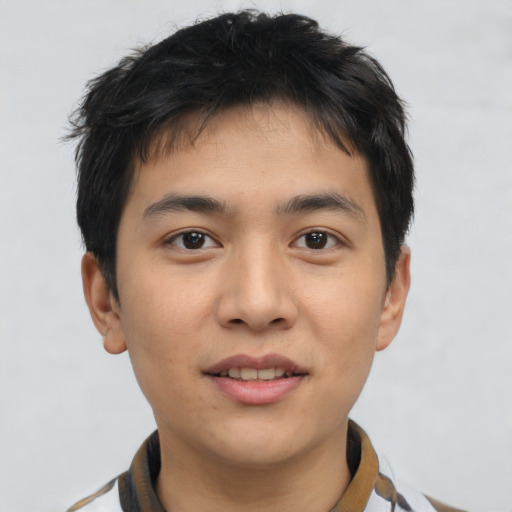 Joyful asian young-adult male with short  brown hair and brown eyes