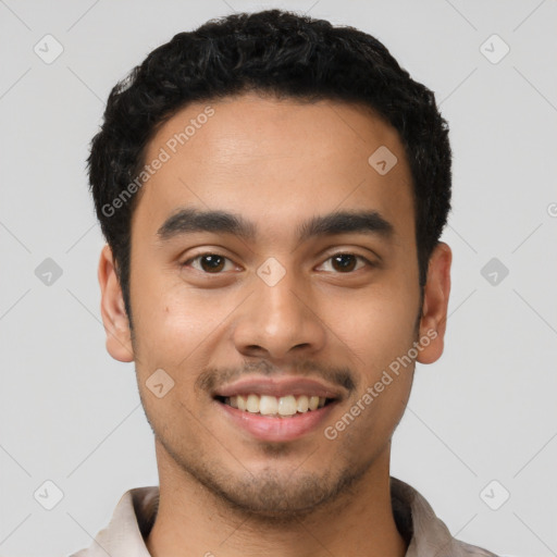 Joyful latino young-adult male with short  black hair and brown eyes