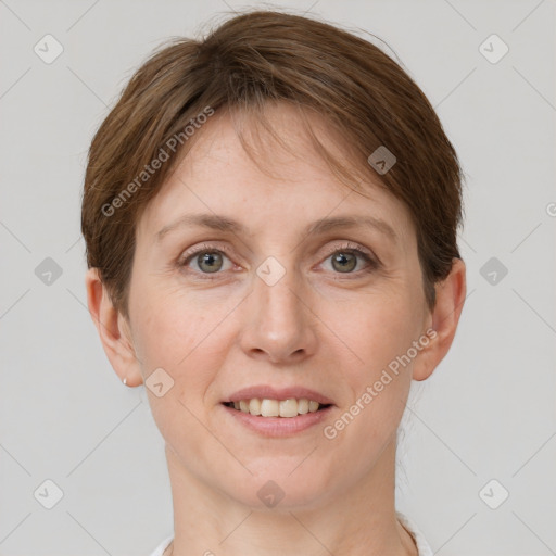 Joyful white adult female with short  brown hair and grey eyes